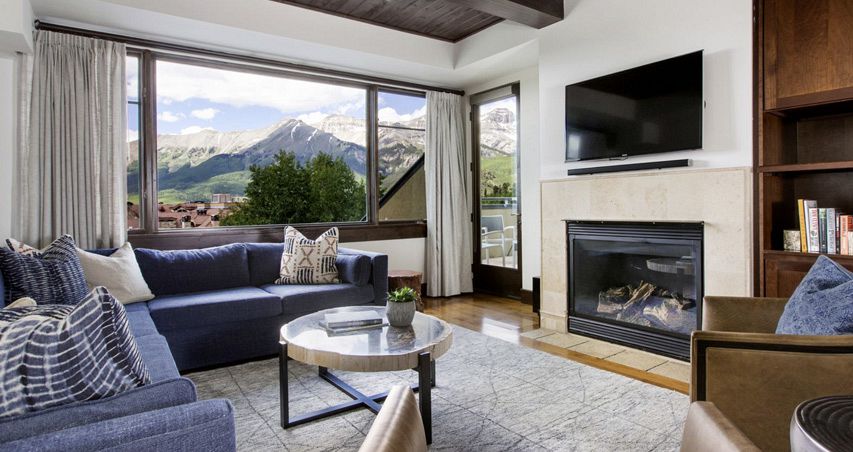 Spacious living areas with fireplace and balcony. - image_5
